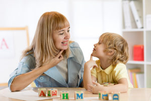 a child participates in a speech therapy program